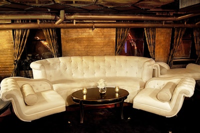 The space features upholstered leather banquette seating.