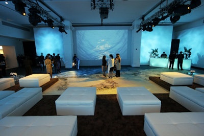 The main room of Espace was set with white lounge furniture.