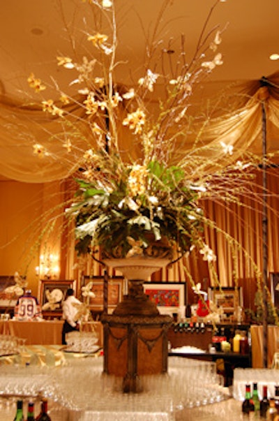 A towering floral arrangement, courtesy of Creations by Gitta, provided a focal point in the centre of the bar in the silent-auction room.