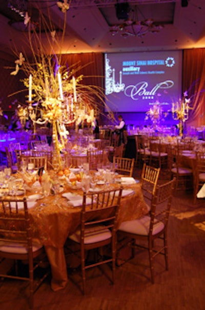 Sheer gold sequined linens topped the dining tables, which were surrounded by Chiavari chairs.