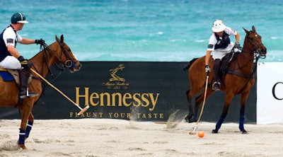 Event sponsors' logos lined the inside walls of the playing field set up on the beach behind the Setai.