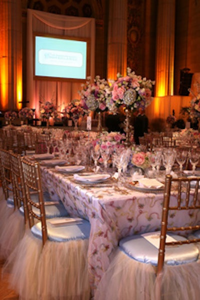 The dining room featured tutu seat covers and shimmery white tablecloths embellished with pink, yellow, and blue ribbon.