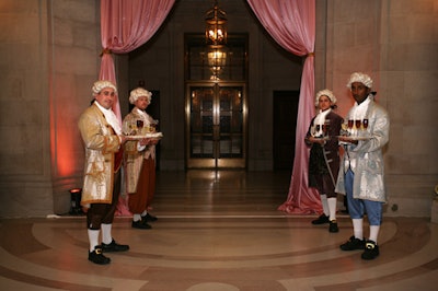 Footmen donning classical costumes and powdered wigs greeted guests.