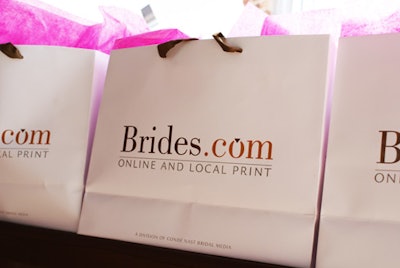 Each guest was given a gift bag filled with goodies featuring the Brides Florida logo, a wedding-dress-shaped cookie from Chocolate Pi, and a collection of vendors' business cards.