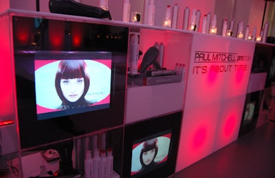 The 10-foot-long bar with video screens displayed hairstyling products from the Pro Tools collection.