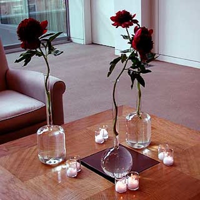 Serena Bass Catering placed gorgeous red peonies in tall glass vases around the room.