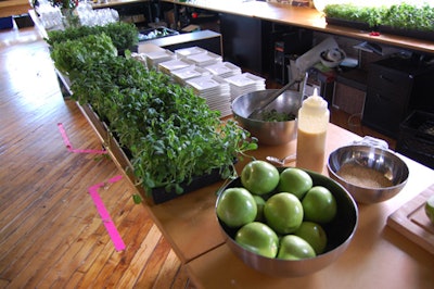 Flats of greens were used as both decoration and food, with caterers serving salads with sliced green apple, sesame seeds, and citrus dressing.