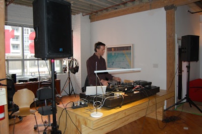 A DJ booth fashioned out of office furniture added to the industrial vibe of the event.