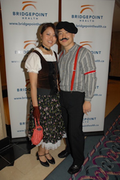 Volunteer event staffers dressed in French-inspired costumes to fit with the theme.