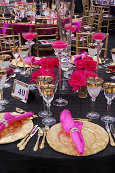 Goblet-like glasses and silky hot-pink napkins captured the gaudy, Versace-inspired aesthetic.