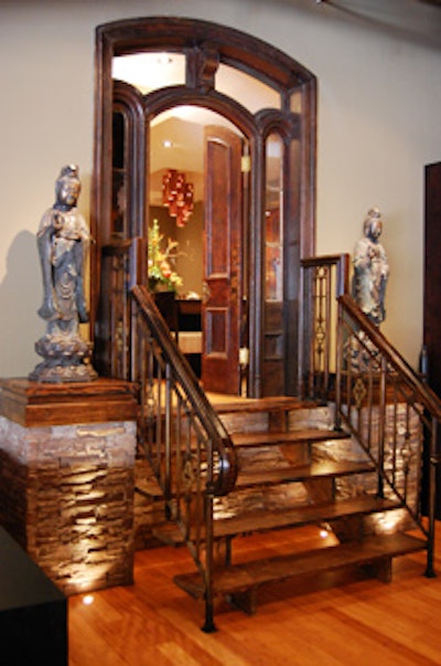 Two antique doors at the top of a small staircase lead to a private room that holds 22 for meetings or dinner.