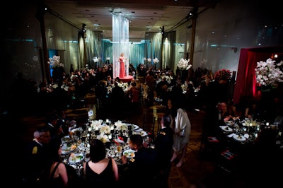 During the dinner, models walked down raised runways, set up amid the tables.