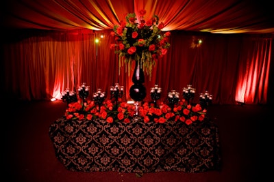 One of the predinner reception areas featured all-red decor, with red rose bouquets and red draped walls.