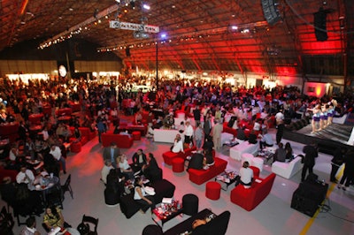 Red lighting and lounge seating covered Barker Hangar.