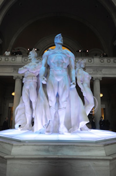 Painted to look like marble sculptures, 20-foot-tall statues of superheroes stood in the museum's Great Hall.