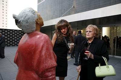 Guests admired work by honorees John Ahearn and Rigoberto Torres on the second-floor patio.
