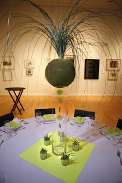 Moss balls with three-foot blades of grass topped every table.