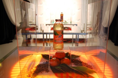 A draped enclosure opened to reveal the three new flavours of Vitao iced tea encased in glass boxes on the stage.
