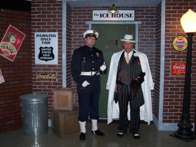 A gangster and Keystone Cop guarded the entrance to the after-dinner speakeasy lounge.
