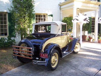 Dana's Classics & Antique Autos set up antique 1920s cars outside the club.