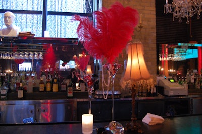 Martini glasses filled with fake jewels and red feathers decorated the bar.