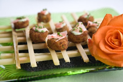 Hors d'oeuvres from Design Cuisine included sesame-crusted crab cakes with wasabi aioli on a sugar cane grid.