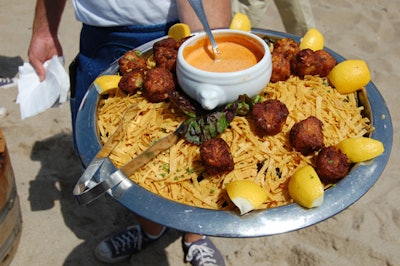 Servers from the Paradise Cove Beach Café passed casual snacks like crab cakes.