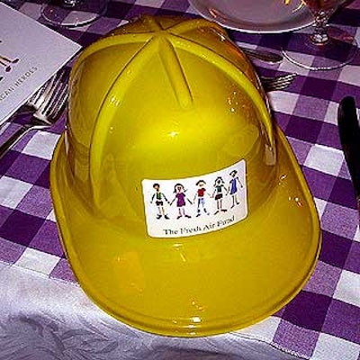 Plastic toy hardhats were placed on guests' seats.