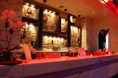Behind the bar in the salon are several picture frames, which can be customized with logos and images for events.