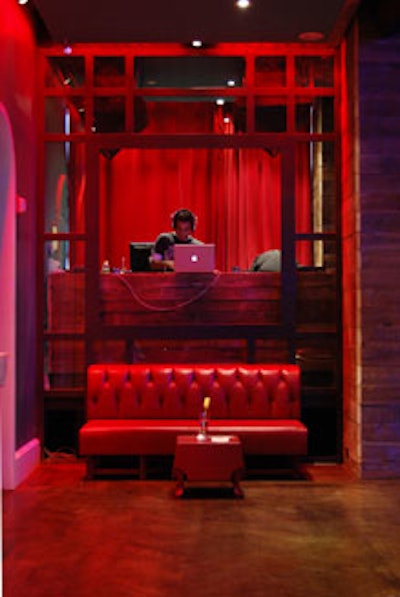 Also in the salon is a DJ booth equipped with high-tech gear including Technics turntables, Pioneer CDJs, and a Rane Serato interface.