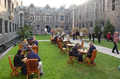 Guests sipped wine at café tables set up in the courtyard at Hart House.