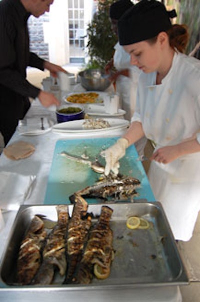 Servers offered samples of barramundi, a popular Australian fish, inside the tent at Friday's event.