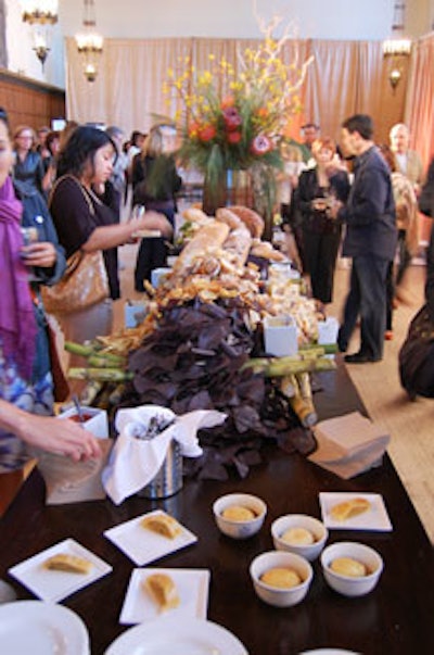 A selection of breads and vegetables topped a long harvest table inside the great hall.
