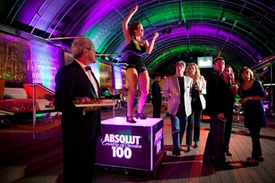 The official Absolut 100 Kanye West after-party at Washington's Love nightclub included go-go dancers on glow boxes in Absolut-emblazed getups.