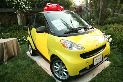 A Toyota Smart Car served as the raffle prize.