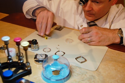 A trained watchmaker dissects Patek pieces on site.