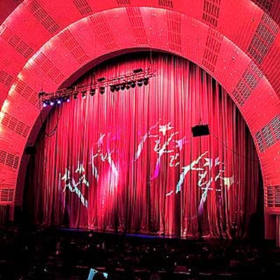 Before the awards show began, Bestek Lighting & Staging shone rainbow lights through gobos of the FiFi logo on the stage curtain.
