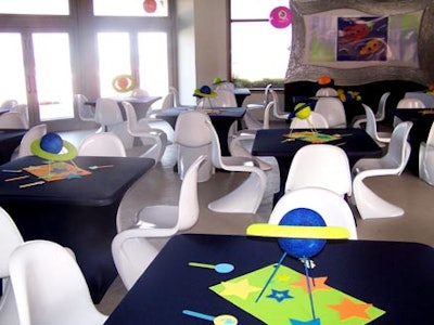 The children's corner featured space-themed decor on the walls and tabletops.