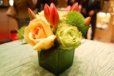 Small floral arrangements topped cocktail tables throughout the Bloor Street store.