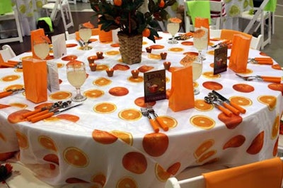 Each table highlighted one of three citrus fruits with sparkling patterned linens and was topped with a grove-inspired centerpiece using greenery such as bear grass, orange leaves, and willow branches.