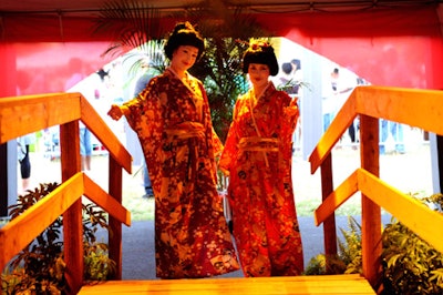 Two geishas greeted guests as they entered the tent.