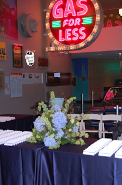 A reception table on the museum's lower level welcomed guests with flowers and placecards.