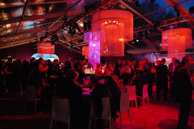 White tasseled chandeliers changed colors during the evening.