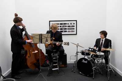 During the V.I.P. reception, a jazz trio (led by the son of one of the board members) played in a small room off the kitchen.