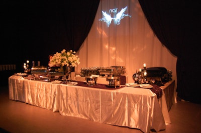 Organizers projected the Noir logo onto the white fabric backdrop behind the food station at the rear of the main room.