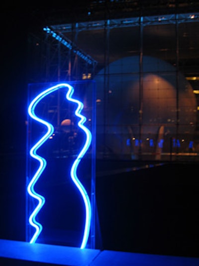 Wavy neon sculptures decorated the American Museum of Natural History's outdoor terrace at the 2002 party, with the Hayden Planetarium lit blue behind it.