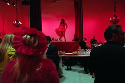 Twelve burlesque dancers performed on a raised stage set in the centre of a mirrored bar.