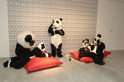 The 'Panda Orgy' installation by Katie Bethune-Leaman included students in panda costumes in front of a wallpapered backdrop.