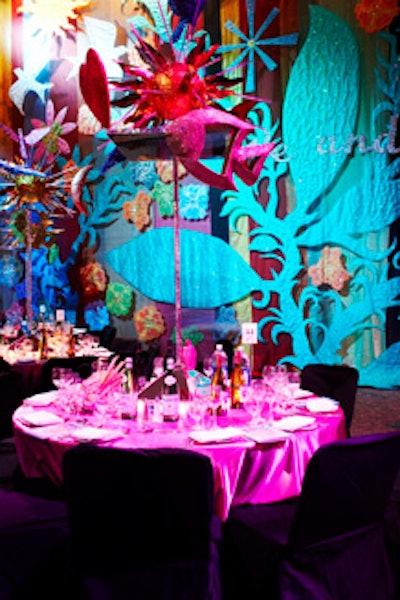 Tall starburst centrepieces including sculpted fish, hearts, and birds topped tables in the dining room.