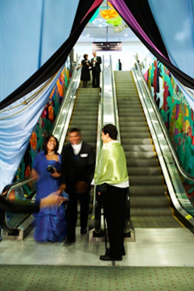 Colourful murals decorated the walls alongside the escalators at the entrance to the venue.